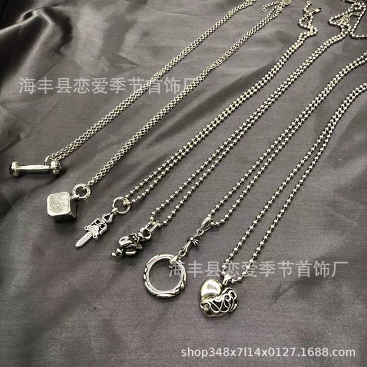 Chrome Hearts heart-shaped sword cross pendant